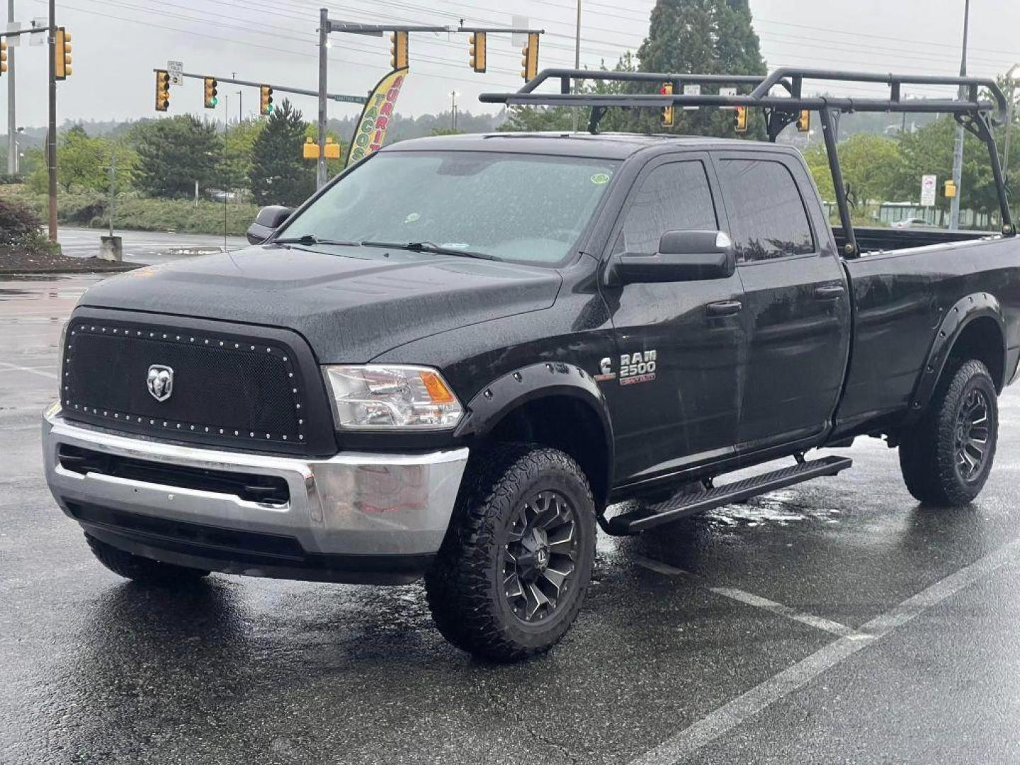 2015 Black Forest Green Pearlcoat /Gray RAM 2500 TRADESMAN CREW CAB LWB ST (3C6UR5HL2FG) with an 6.7L engine, Automatic transmission, located at 1505 S 356th St., Federal Way, WA, 98003, 47.282051, -122.314781 - This Ram 2500 Cummins TurboDiesel 4x4 has a beautiful Black Forest Green Pearlcoat exterior like you've never seen before - ONE OF A KIND! Gooseneck towing package with air suspension, custom grill, running boards, powder coated wood rack. Brand new rotors and pads drilled and slotted, straight pipe - Photo#0